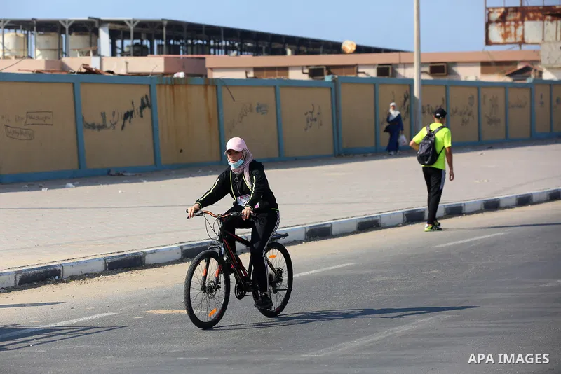 Palestinians take part in a bike race championship including disabled people, in Gaza city, on June 30, 2021. Photo by Ashraf Amra