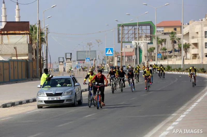 Palestinians take part in a bike race championship including disabled people, in Gaza city, on June 30, 2021. Photo by Ashraf Amra