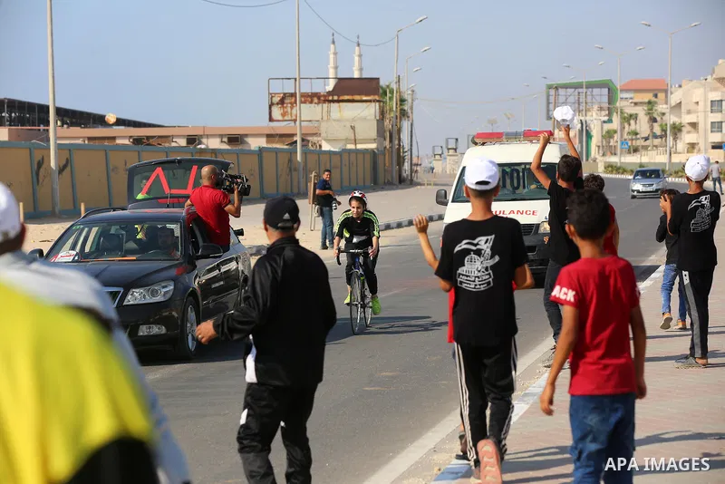 Palestinians take part in a bike race championship including disabled people, in Gaza city, on June 30, 2021. Photo by Ashraf Amra