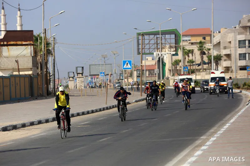 Palestinians take part in a bike race championship including disabled people, in Gaza city, on June 30, 2021. Photo by Ashraf Amra