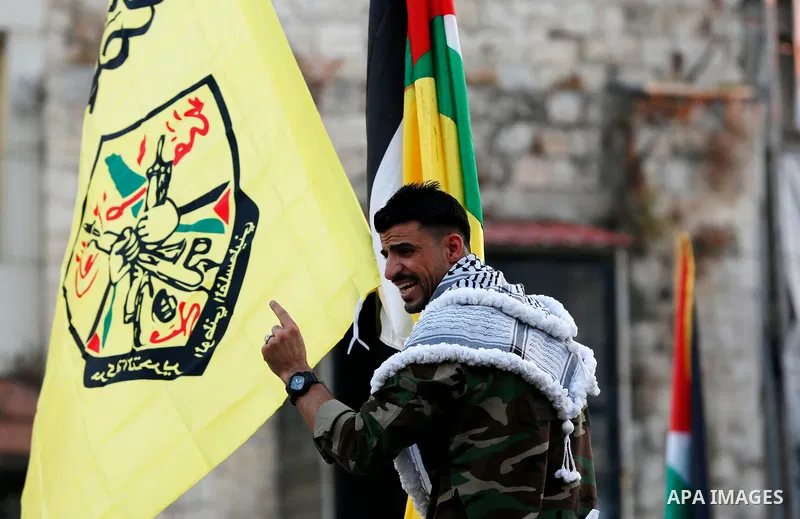Palestinian supporters Fatah movement take part in a rally in support of Palestinian president Mahmud Abbas in the West Bank city of Nablus on June 30, 2021. Photo by Stringer