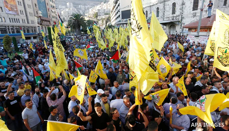 Palestinian supporters Fatah movement take part in a rally in support of Palestinian president Mahmud Abbas in the West Bank city of Nablus on June 30, 2021. Photo by Stringer
