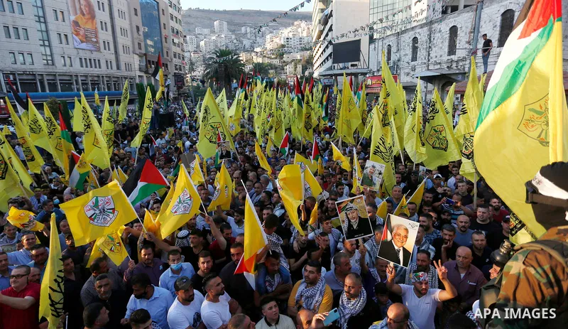 Palestinian supporters Fatah movement take part in a rally in support of Palestinian president Mahmud Abbas in the West Bank city of Nablus on June 30, 2021. Photo by Stringer