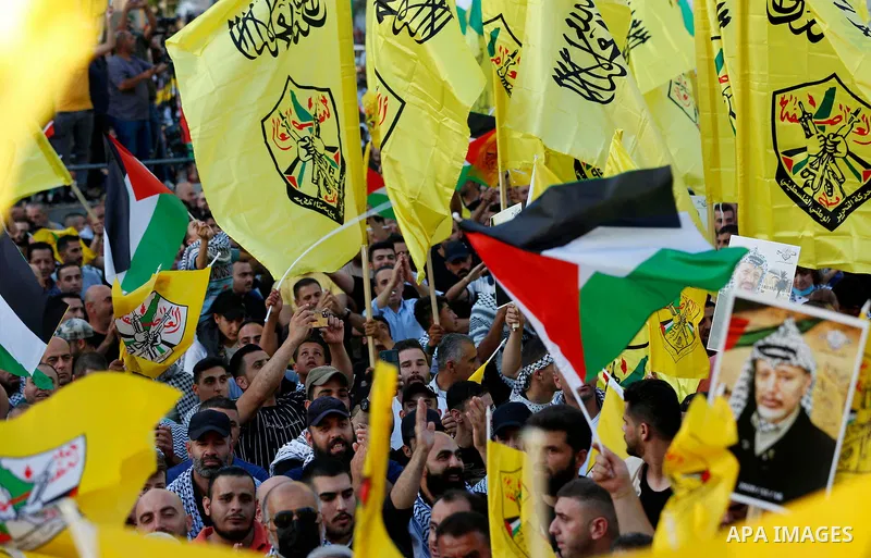 Palestinian supporters Fatah movement take part in a rally in support of Palestinian president Mahmud Abbas in the West Bank city of Nablus on June 30, 2021. Photo by Stringer