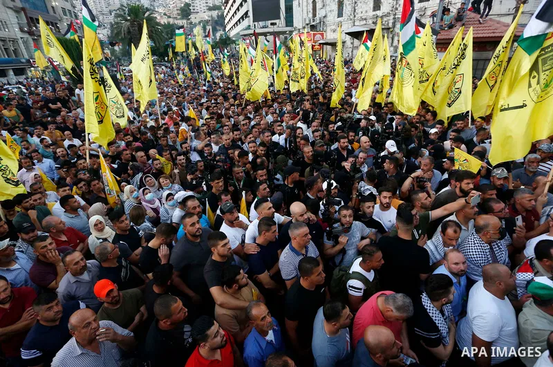 Palestinian supporters Fatah movement take part in a rally in support of Palestinian president Mahmud Abbas in the West Bank city of Nablus on June 30, 2021. Photo by Stringer