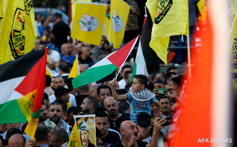 Palestinian supporters Fatah movement take part in a rally in support of Palestinian president Mahmud Abbas in the West Bank city of Nablus on June 30, 2021. Photo by Stringer