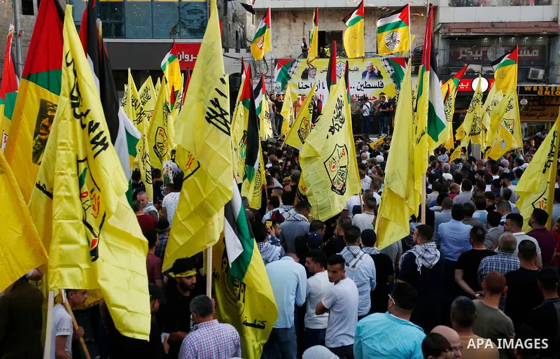 Palestinian supporters Fatah movement take part in a rally in support of Palestinian president Mahmud Abbas in the West Bank city of Nablus on June 30, 2021. Photo by Stringer