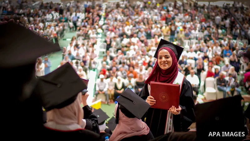 Palestinian students attend their graduation ceremony at Birzeit University in the West Bank city of Ramallah, on June 30, 2021. Photo by Eyad Jadallah