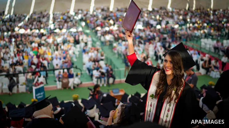 Palestinian students attend their graduation ceremony at Birzeit University in the West Bank city of Ramallah, on June 30, 2021. Photo by Eyad Jadallah