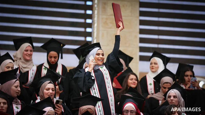 Palestinian students attend their graduation ceremony at Birzeit University in the West Bank city of Ramallah, on June 30, 2021. Photo by Eyad Jadallah