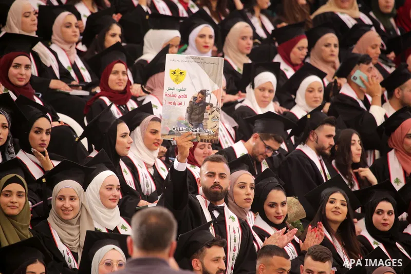 Palestinian students attend their graduation ceremony at Birzeit University in the West Bank city of Ramallah, on June 30, 2021. Photo by Ibrahim atta