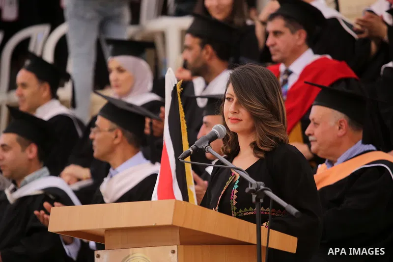 Palestinian students attend their graduation ceremony at Birzeit University in the West Bank city of Ramallah, on June 30, 2021. Photo by Ibrahim atta