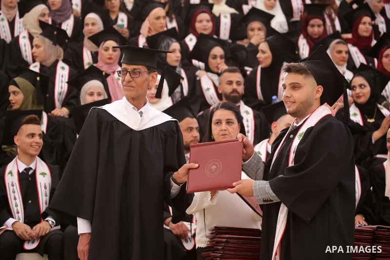 Palestinian students attend their graduation ceremony at Birzeit University in the West Bank city of Ramallah, on June 30, 2021. Photo by Ibrahim atta