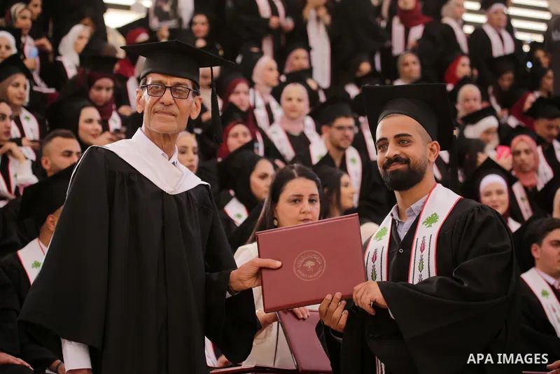 Palestinian students attend their graduation ceremony at Birzeit University in the West Bank city of Ramallah, on June 30, 2021. Photo by Ibrahim atta