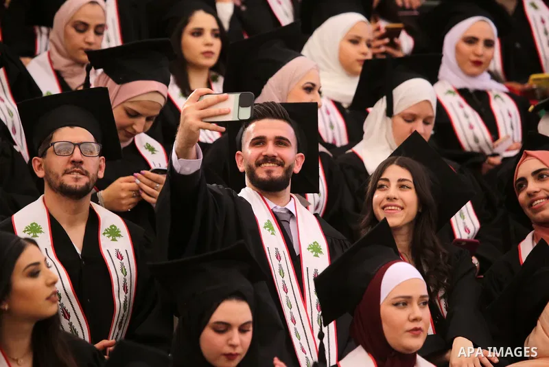 Palestinian students attend their graduation ceremony at Birzeit University in the West Bank city of Ramallah, on June 30, 2021. Photo by Ibrahim atta