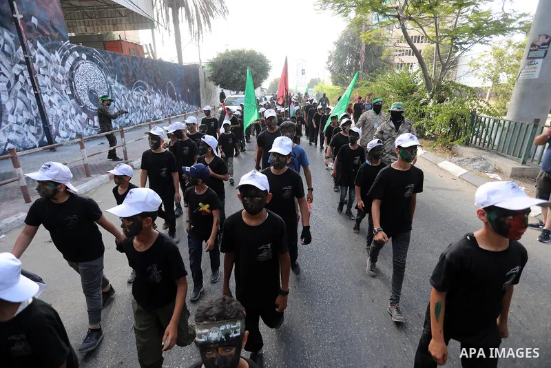 Young Palestinians take part in a graduation ceremony at a military summer camp organised by the Hamas Movement, in Gaza City July 01, 2021. Photo by Ashraf Amra