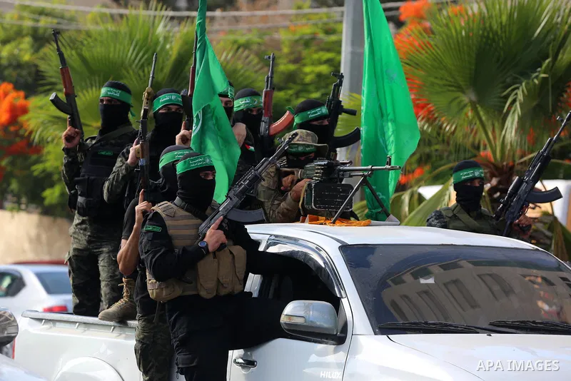 Young Palestinians take part in a graduation ceremony at a military summer camp organised by the Hamas Movement, in Gaza City July 01, 2021. Photo by Ashraf Amra
