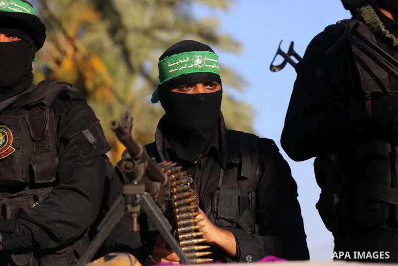 Young Palestinians take part in a graduation ceremony at a military summer camp organised by the Hamas Movement, in Deir al-Balah, in the center of Gaza Strip on July 01, 2021. Photo by Ashraf Amra