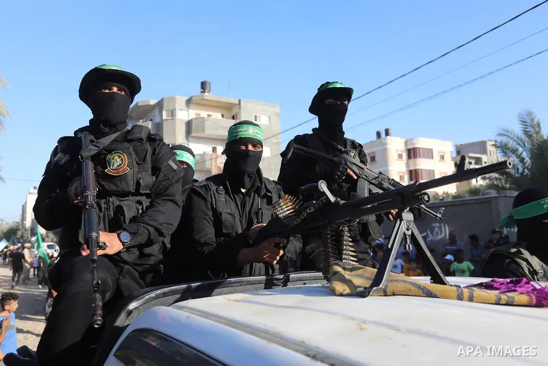 Young Palestinians take part in a graduation ceremony at a military summer camp organised by the Hamas Movement, in Deir al-Balah, in the center of Gaza Strip on July 01, 2021. Photo by Ashraf Amra