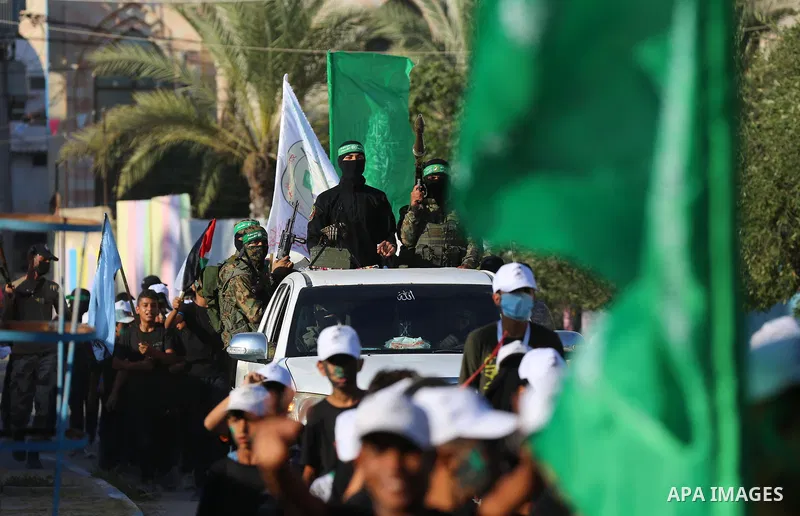 Young Palestinians take part in a graduation ceremony at a military summer camp organised by the Hamas Movement, in Deir al-Balah, in the center of Gaza Strip on July 01, 2021. Photo by Ashraf Amra