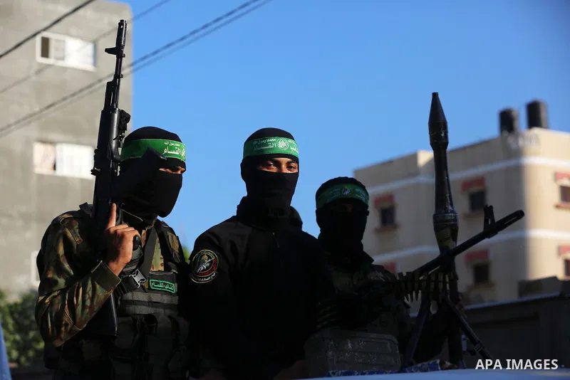 Young Palestinians take part in a graduation ceremony at a military summer camp organised by the Hamas Movement, in Deir al-Balah, in the center of Gaza Strip on July 01, 2021. Photo by Ashraf Amra