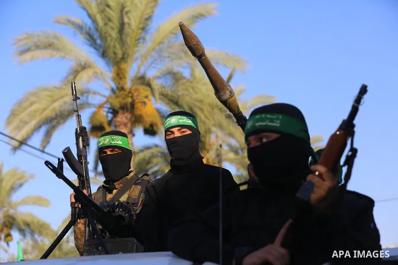 Young Palestinians take part in a graduation ceremony at a military summer camp organised by the Hamas Movement, in Deir al-Balah, in the center of Gaza Strip on July 01, 2021. Photo by Ashraf Amra