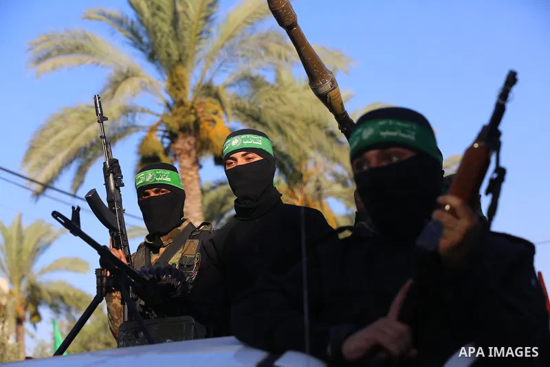 Young Palestinians take part in a graduation ceremony at a military summer camp organised by the Hamas Movement, in Deir al-Balah, in the center of Gaza Strip on July 01, 2021. Photo by Ashraf Amra