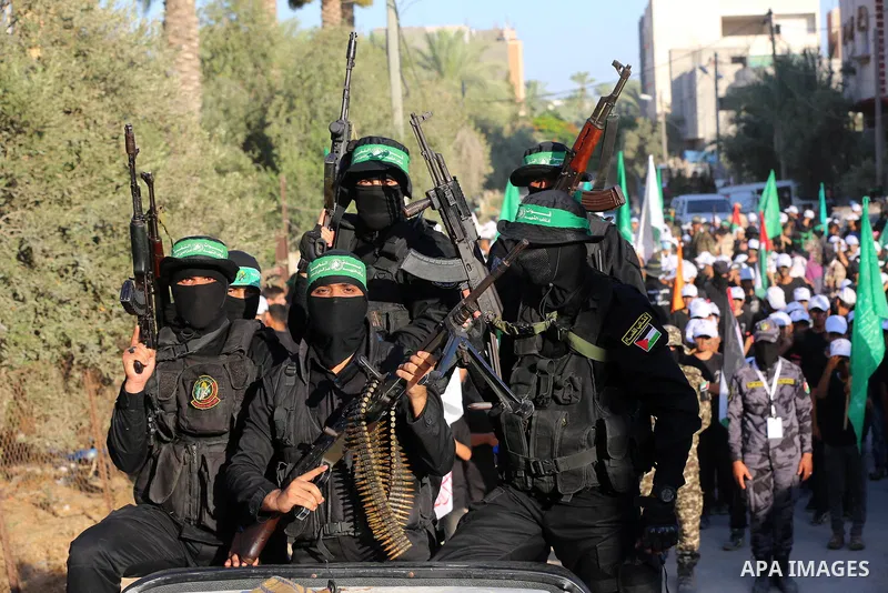 Young Palestinians take part in a graduation ceremony at a military summer camp organised by the Hamas Movement, in Deir al-Balah, in the center of Gaza Strip on July 01, 2021. Photo by Ashraf Amra