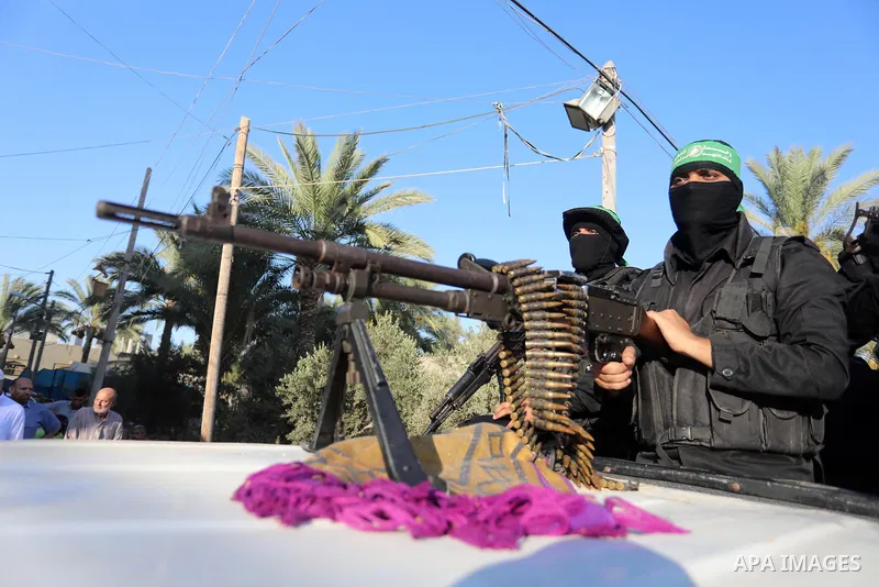 Young Palestinians take part in a graduation ceremony at a military summer camp organised by the Hamas Movement, in Deir al-Balah, in the center of Gaza Strip on July 01, 2021. Photo by Ashraf Amra