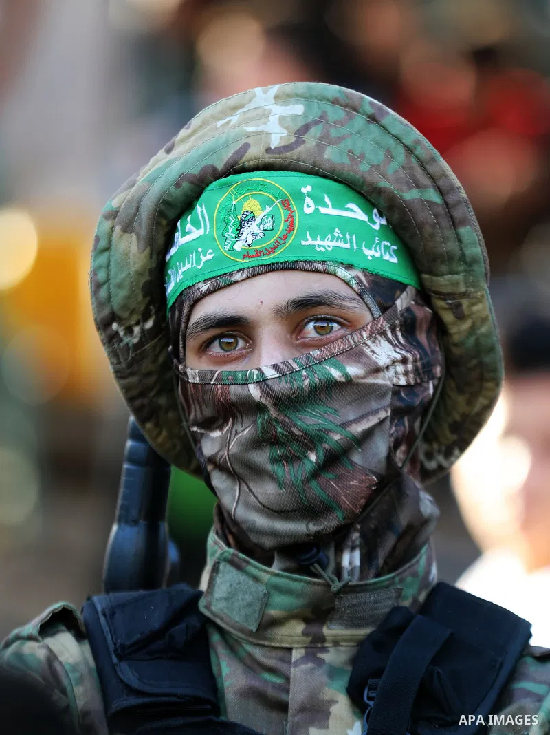 Young Palestinians take part in a graduation ceremony at a military summer camp organised by the Hamas Movement, in Gaza City July 01, 2021. Photo by Mahmoud Nasser