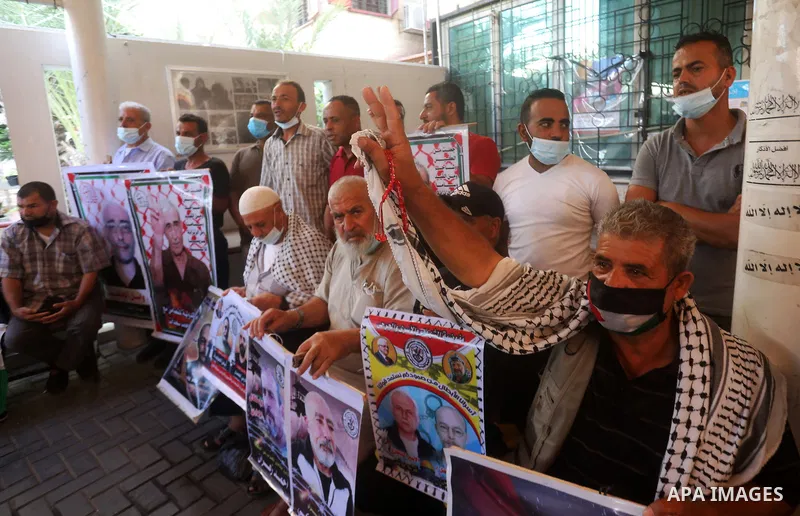 Palestinians take part in a protest to show solidarity with prisoners on hunger strike, in Israeli Jails, in front of the headquarters of Red cross, in Gaza city, on July 05, 2021. Of the thousands behind bars, 430 are a...