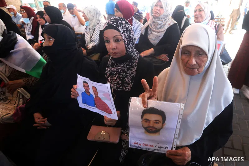 Palestinians take part in a protest to show solidarity with prisoners on hunger strike, in Israeli Jails, in front of the headquarters of Red cross, in Gaza city, on July 05, 2021. Of the thousands behind bars, 430 are a...