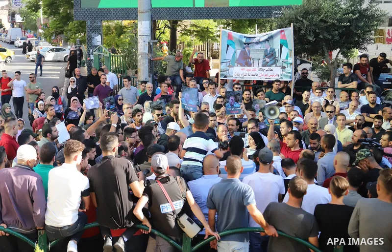 Demonstrators take part in a protest against the death of late Palestinian activist Nizar Banat, who died in late June following arrest by Palestinian Authority security forces, in the city of Hebron in the West Bank on...
