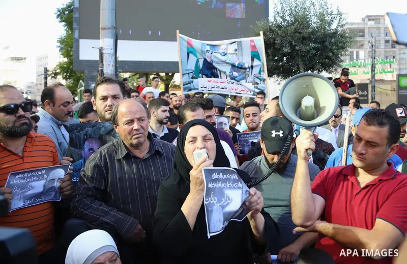 Demonstrators take part in a protest against the death of late Palestinian activist Nizar Banat, who died in late June following arrest by Palestinian Authority security forces, in the city of Hebron in the West Bank on...