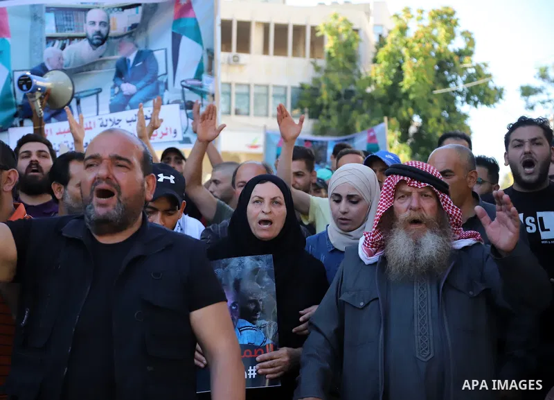 Demonstrators take part in a protest against the death of late Palestinian activist Nizar Banat, who died in late June following arrest by Palestinian Authority security forces, in the city of Hebron in the West Bank on...