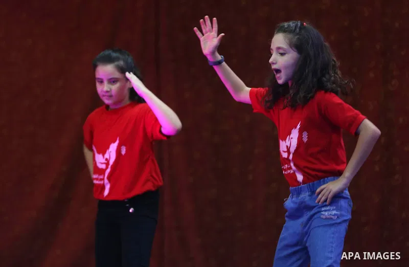 Palestinian children dance dabkeh during a mental health support session, in Gaza city on July 08, 2021. As Gaza tries to recover from the deadly 11-day Israeli attack, mothers and mental health workers have raised conce...