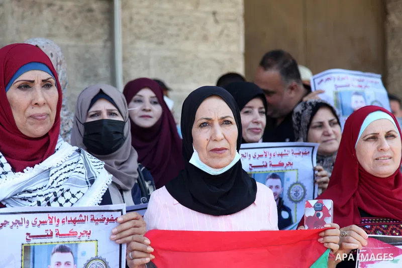 Palestinians take part in a celebration of Ghazanfar Abu Atwan who was released from Israeli Jails, in front of Red Cross office, in Gaza city on July 11 2021. Palestinian prisoner Ghazanfar Abu Atwan has suspended his h...
