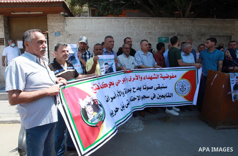 Palestinians take part in a celebration of Ghazanfar Abu Atwan who was released from Israeli Jails, in front of Red Cross office, in Gaza city on July 11 2021. Palestinian prisoner Ghazanfar Abu Atwan has suspended his h...