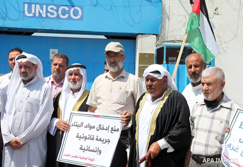 Palestinian clans take part in a protest to demand the opening of the crossings and reconstruction and the entry of building materials, in front of the headquarter United Nation "UNSCO" in Gaza city, on July 11 2021. Pho...