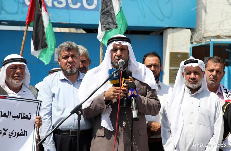 Palestinian clans take part in a protest to demand the opening of the crossings and reconstruction and the entry of building materials, in front of the headquarter United Nation "UNSCO" in Gaza city, on July 11 2021. Pho...