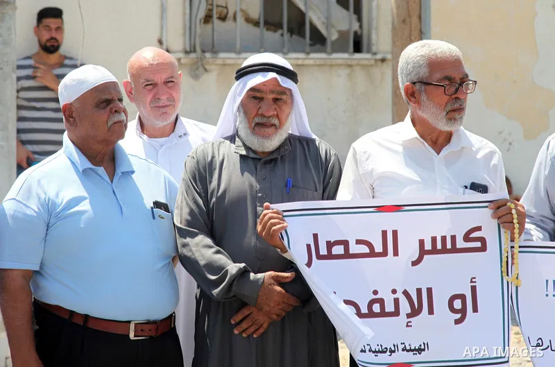Palestinian clans take part in a protest to demand the opening of the crossings and reconstruction and the entry of building materials, in front of the headquarter United Nation "UNSCO" in Gaza city, on July 11 2021. Pho...