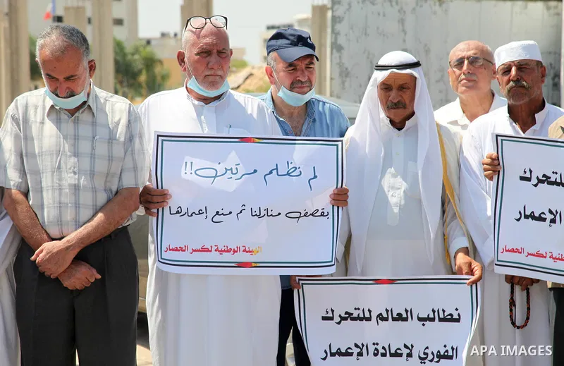 Palestinian clans take part in a protest to demand the opening of the crossings and reconstruction and the entry of building materials, in front of the headquarter United Nation "UNSCO" in Gaza city, on July 11 2021. Pho...