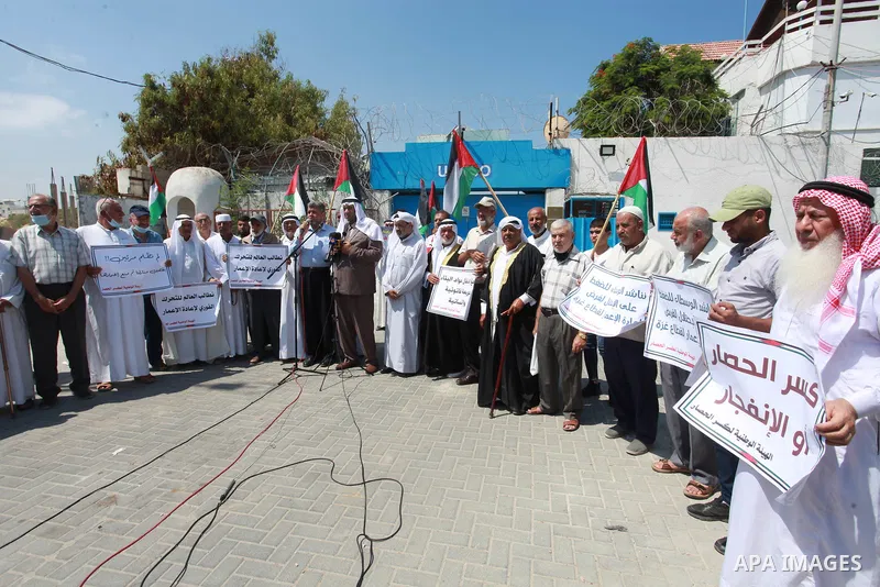 Palestinian clans take part in a protest to demand the opening of the crossings and reconstruction and the entry of building materials, in front of the headquarter United Nation "UNSCO" in Gaza city, on July 11 2021. Pho...