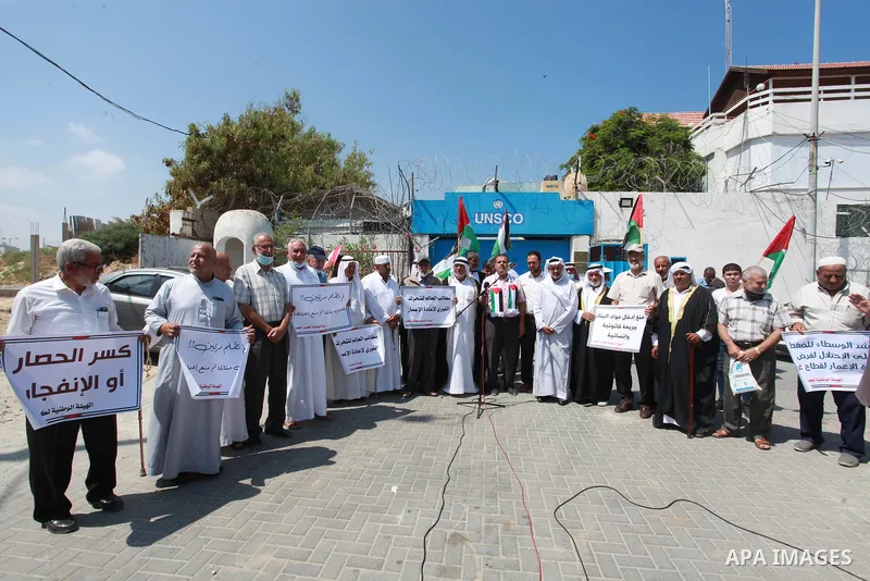 Palestinian clans take part in a protest to demand the opening of the crossings and reconstruction and the entry of building materials, in front of the headquarter United Nation "UNSCO" in Gaza city, on July 11 2021. Pho...
