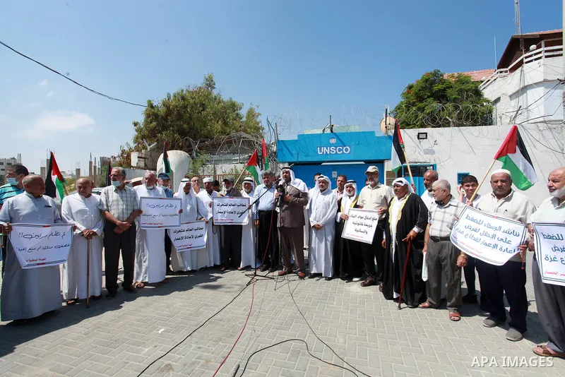 Palestinian clans take part in a protest to demand the opening of the crossings and reconstruction and the entry of building materials, in front of the headquarter United Nation "UNSCO" in Gaza city, on July 11 2021. Pho...