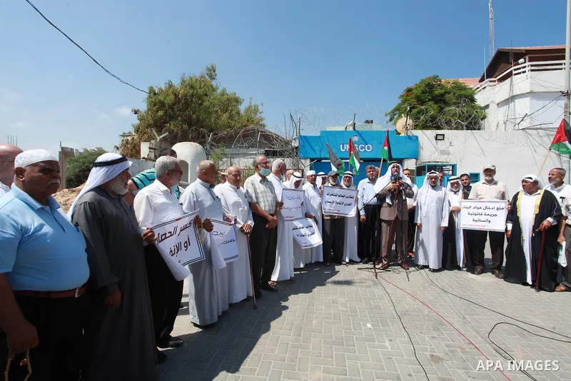 Palestinian clans take part in a protest to demand the opening of the crossings and reconstruction and the entry of building materials, in front of the headquarter United Nation "UNSCO" in Gaza city, on July 11 2021. Pho...