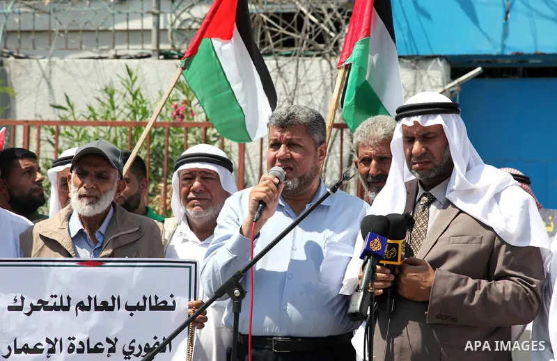 Palestinian clans take part in a protest to demand the opening of the crossings and reconstruction and the entry of building materials, in front of the headquarter United Nation "UNSCO" in Gaza city, on July 11 2021. Pho...