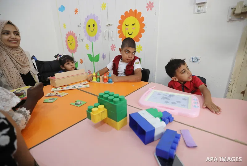 Palestinian children with disabilities practice different activities during a summer camp, in Deir al-Balah in the center in the Gaza Strip on July 11, 2021. Almost 50,000 Palestinians are classified as "disabled" among...