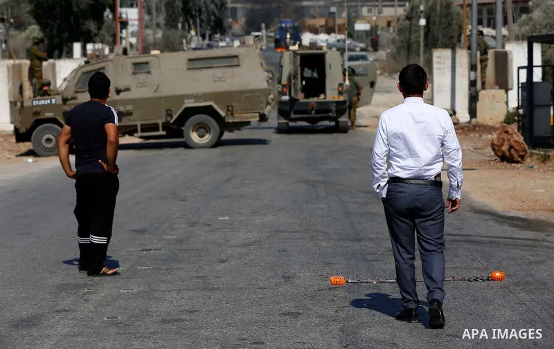 Israeli forces close Beita town entrance near the West Bank city of Nablus, and prevent Palestinians from entering the town, on July 11, 2021. Photo by Shadi Jarar'ah
