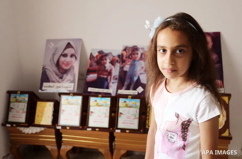 Riad Ishkontana, 42, and his daughter Suzy, 7, in the house of a family member where she is currently living after her house was destroyed in an Israeli airstirke in the recent conflict between Israel and Hamas on May, d...